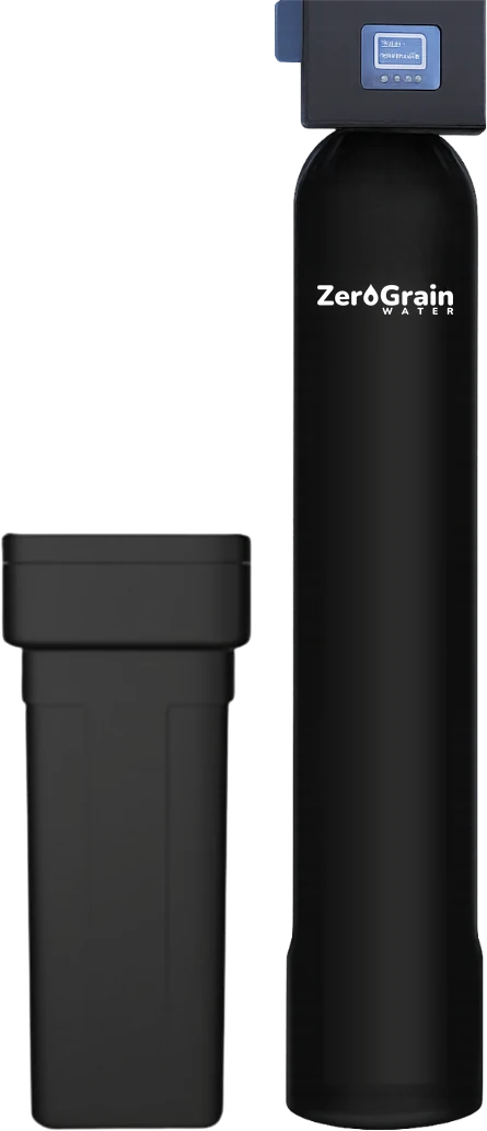 A whole-home softener beside its brine tank, set where a well-fed home's water line comes indoors